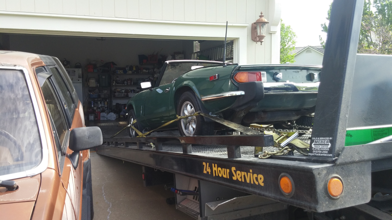 Dropping the little Triumph into its new home.